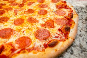A Pepperoni Pizza on a Surface Close Up Copy