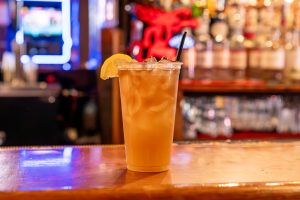 A cocktail sitting on a bar