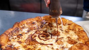 A pizza being prepared